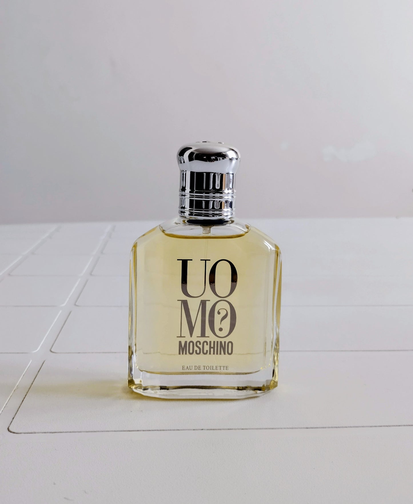 Moschino perfume bottle on a white surface