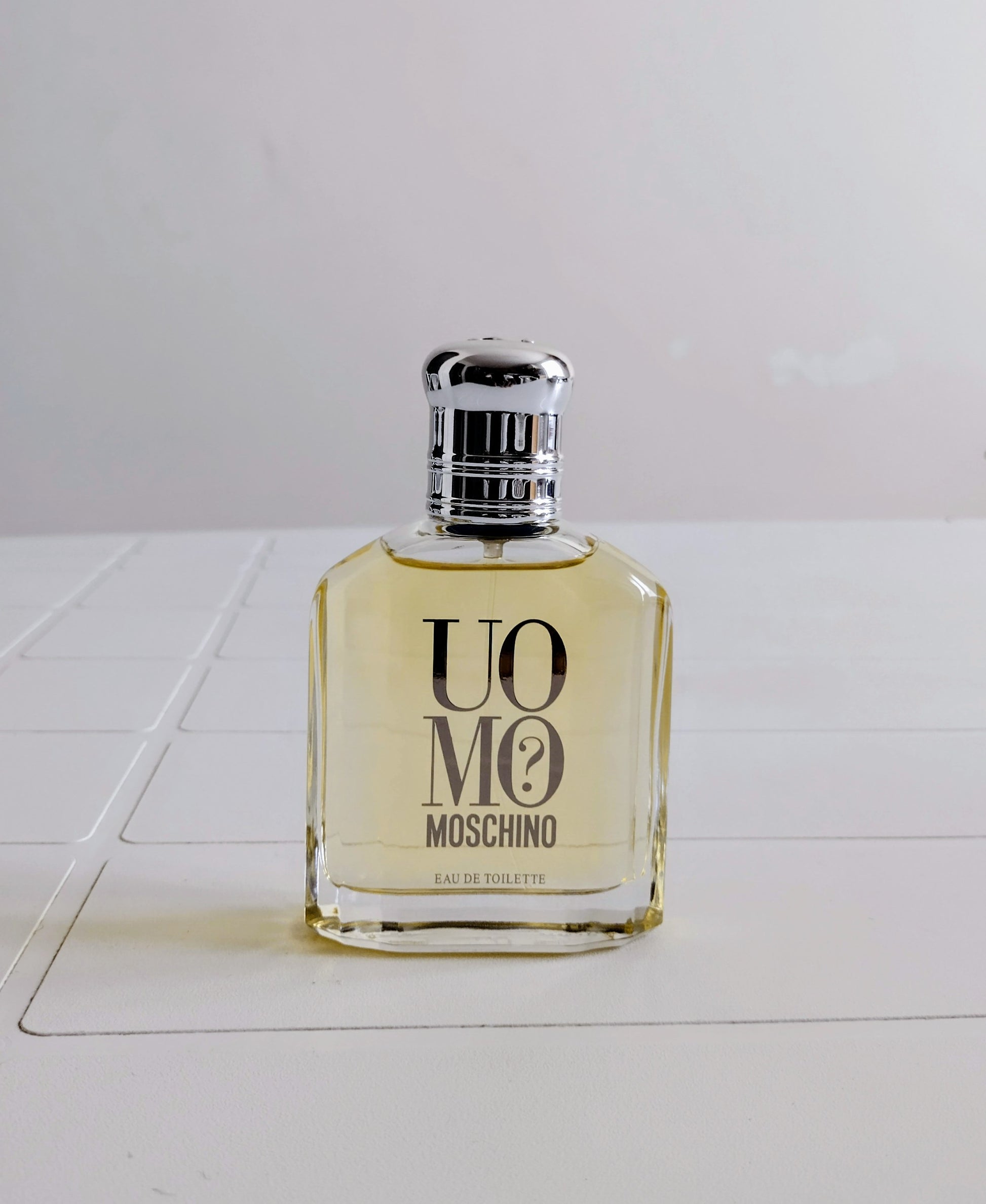 Moschino perfume bottle on a white surface